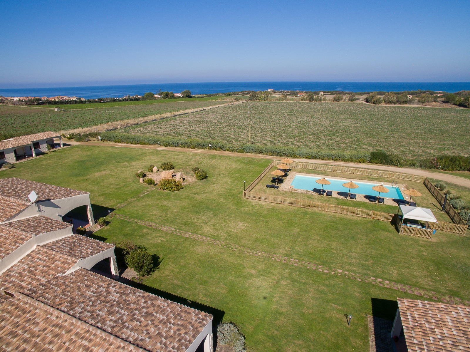 Tenute Costadoria resort — pool, villas and Mediterranean hills